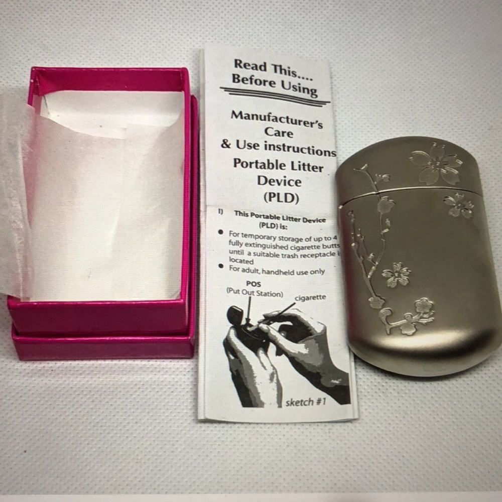 Very Vintage NIB Virginia Slims Portable Litter Device has a flower design.